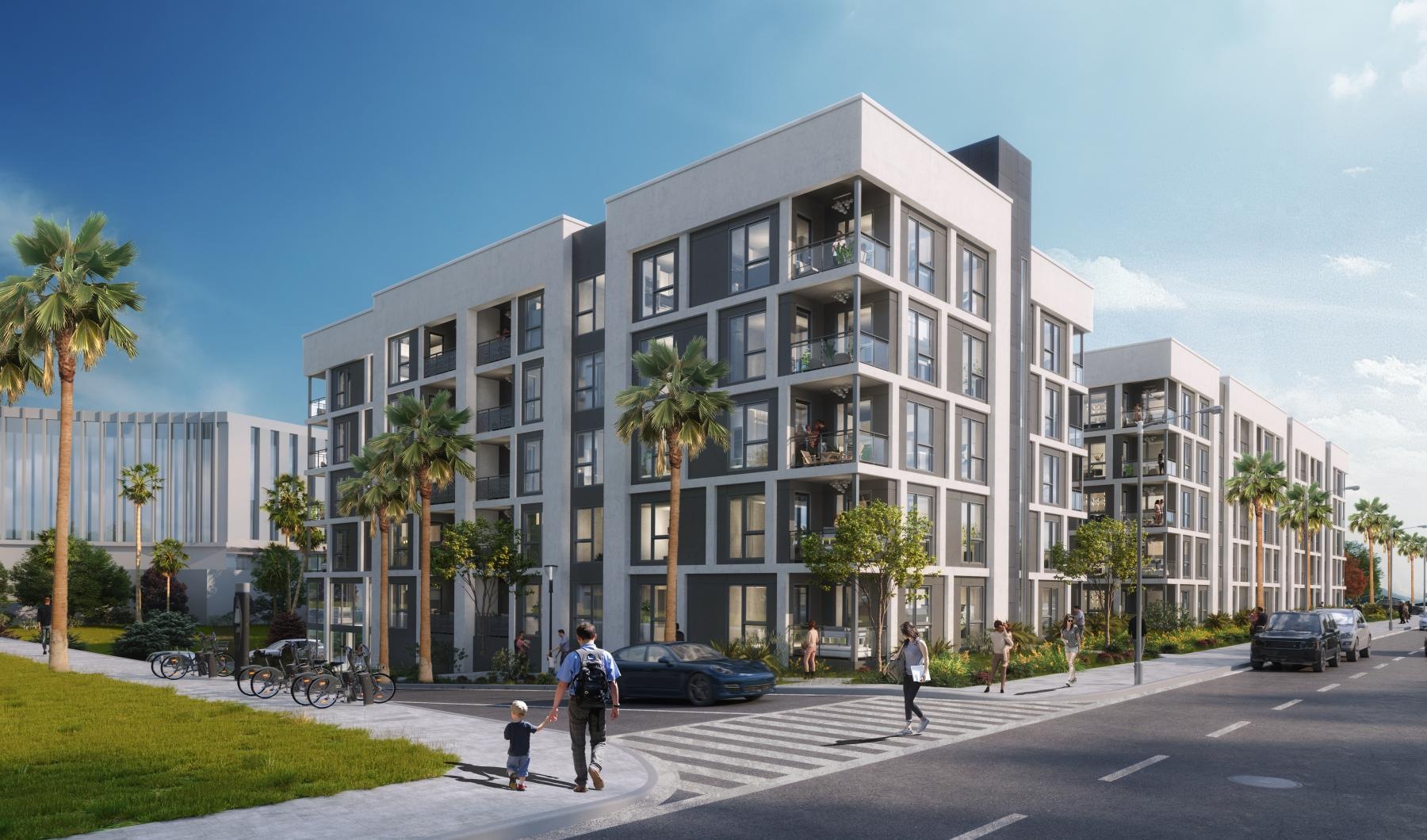 a building with palm trees and people walking on the sidewalk