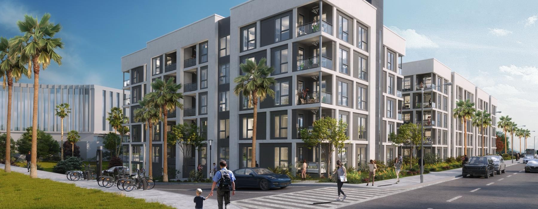 a building with palm trees and people walking on the sidewalk